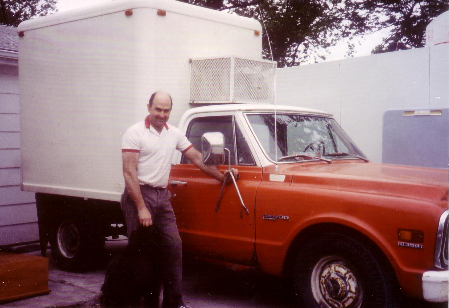 Ken Banwart standing next to his delivery truck