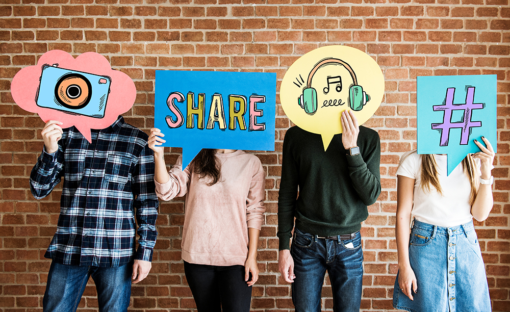 Fundraising with social media - teens standing in front of brick well holding signs over face that depict different social media activities