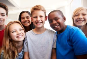 How kids benefit from fundraising - group of middle school kids standing together smiling