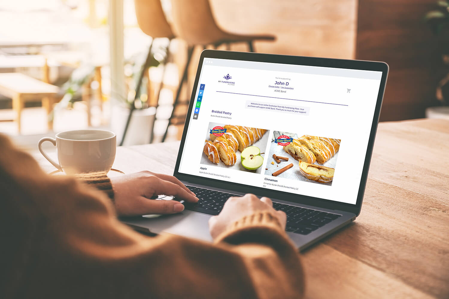 A person is sitting at a laptop that shows a Butter Braid® Pastry online store for a local fundraiser.