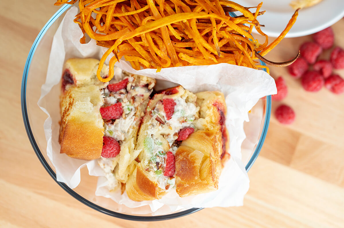 Raspberry Chicken Salad Sandwiches next to a pile of sweet potato fries.