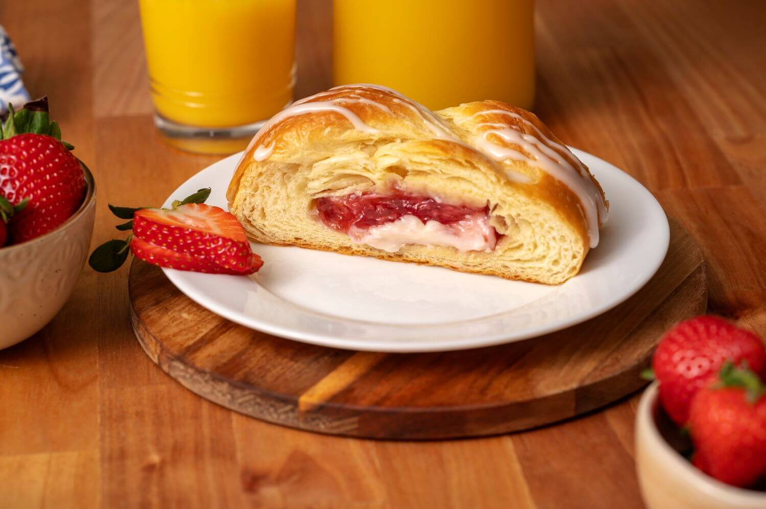 Slice of Strawberry Cream Cheese Butter Braid Pastry on a plate.