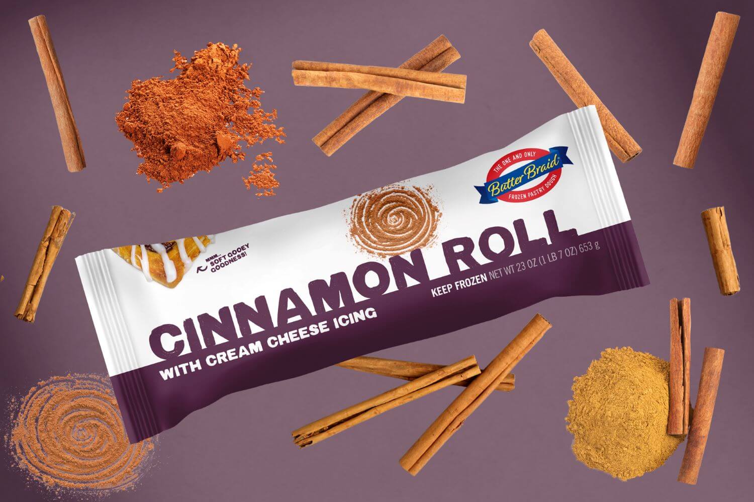 Cinnamon Roll Butter Braid Pastry Packaging on a dark purple background with cinnamon sticks and cinnamon powder.
