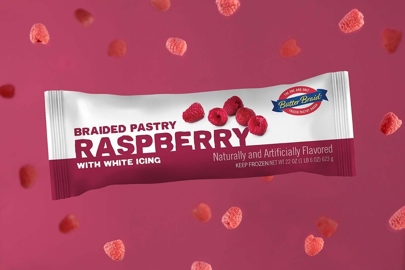 Raspberry Butter Braid Pastry Packaging on a dark magenta background with fresh raspberries.