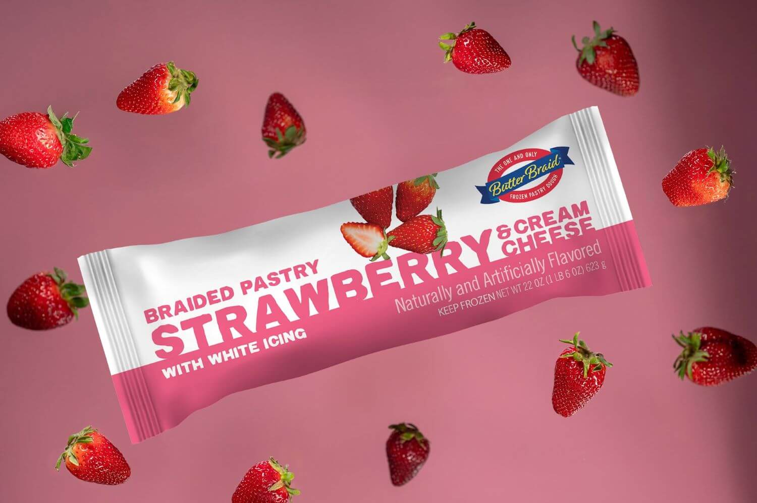 Strawberry Cream Cheese Butter Braid Pastry Packaging on a light pink background with fresh strawberries.